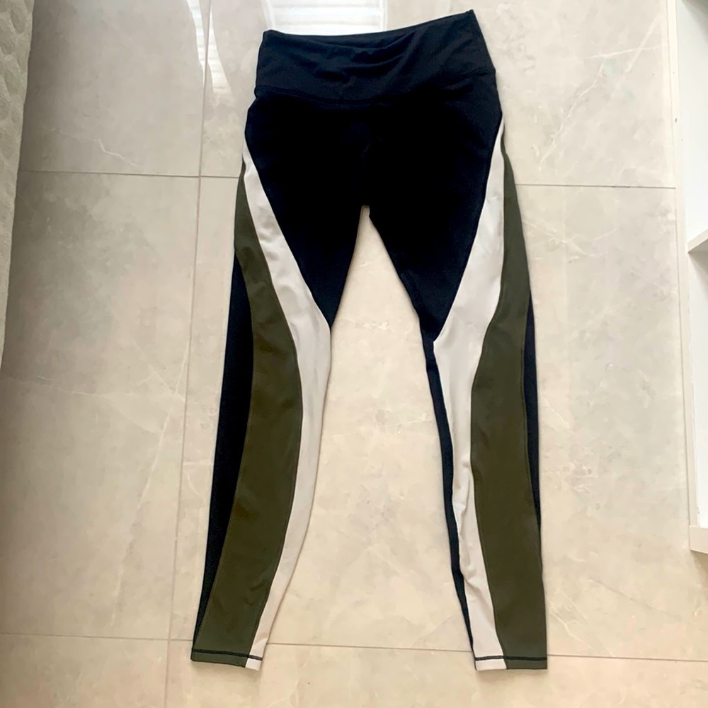 Black with green and white stripes H&M sport legging. Size small.
